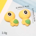 Macro shot of resin turtle charms with size 2.4cm and weight 2.0g for DIY crafts - Yellow Turtle