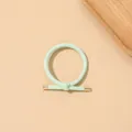 Close-up of mint green ribbed knot hair tie with elegant gold metal tips - Ribbed Knot - Metal Buckle / Mint Green