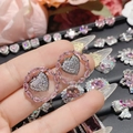 Macro detail of heart-shaped earrings with pink marquise-cut gems and 18K gold finish - 0023 Pink Diamond Heart Ring Studs