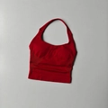 Close-up of red halter sports bra showing seamless knit texture and mesh detailing - Scarlett Red