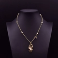 Golden leaf necklace with blue butterfly and white pearls on long winter sweater chain - Butterfly Metal Leaf Pearl Necklace