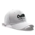 White baseball cap featuring green 3D letter embroidery in a vintage cotton twill style - Adjustable / White