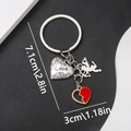 Detail view of zinc alloy keychain featuring Love heart, Cupid, and red broken heart charm - Heart Angel Style (ER388)