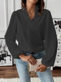 Elegant black long sleeve ruffle blouse with V-neckline for women in indoor setting - Black