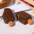 Close-up of two realistic resin chocolate popsicles for DIY phone case and accessory crafts - Bitten Popsicle / Coffee