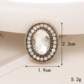 Macro detail of vintage gold oval charm with rhinestones showing 1.9cm x 2.3cm dimensions - D1732 Rhinestone Glass Oval