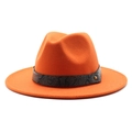 Detail of orange fedora hat featuring a snakeskin pattern band and gold metal rivet - Orange