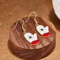Christmas glove earrings in white and red with green snowflake pattern on wood base - White Face Green Snowflake Mitten Style (E00915G)