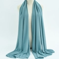 Elegant teal green chiffon hijab scarf on a mannequin in a professional studio setting - 78