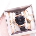Close-up of a 4-piece jewelry gift set with a gold quartz watch and three bracelets - Black + Bracelet + Box