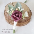 Burgundy artificial rose boutonniere with white cotton stem on a rustic wood base - Dark Mauve