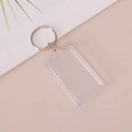 Rectangular clear acrylic photo keychain with a silver metal split ring on a soft pink background - Rectangle 3.2x5.2cm