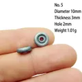 Macro view of 10mm retro silver alloy flower spacer bead on finger for size scale - 5#
