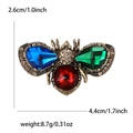 Vintage gold bee brooch with colorful crystals and rhinestones showing size measurements - Colorful
