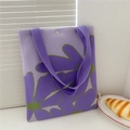 Detail of purple knitted tote bag with green flower pattern and silver snap closure - Big Flower Purple