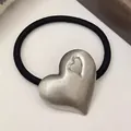 Minimalist elastic hair tie with silver brushed metal heart pendant and cutout detail - Single Hollow Heart / Silver