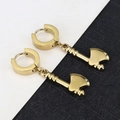 Close-up of golden axe charm earrings with a polished finish and punk-style circular buckles - Axe - Gold