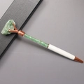 Detail of white metal ballpoint pen with green crystal stone filling and rose gold finish - Aventurine Jade