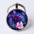Silver tone keychain pendant featuring a vintage purple rose and blue butterfly glass gem - Starry Sky Rose Butterfly