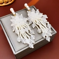 Frosted floral earrings with white pearl tassels and gold accents on jewelry box - Gold White Pearl Tassel (204#)