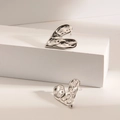 Irregular liquid metal heart stud earrings in polished silver finish with wrinkled texture - Wavy Heart / Steel