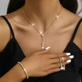 Detailed view of luxury bridal jewelry set with shimmering crystals and golden finish - 446+428-1 Gold Set
