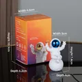 Blue-faced astronaut figurine on moon sphere with dimensions 7.4x5x4cm and original box - Small Plated Blue Model C (Color Box)
