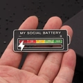 Adjustable metal enamel social battery pin showing power levels from zero to full - Social Battery Slider Black