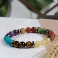 Close-up of natural colorful stone beads bracelet with vintage metal spacers and soft reflection - Multi-color