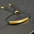 Minimalist black braided cord bracelet featuring a polished gold curved metal bar - Black Cord Gold