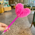 Close-up of a fluffy hot pink heart-shaped pom-pom top on a vibrant plastic pen - Rose Red