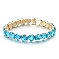 Detail of heart-shaped sky blue cubic zirconia stones set in a gold-plated bracelet - Sky Blue