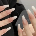 Macro shot of long coffin shaped press-on nails with nude pink to white gradient finish - Cdj-3-614