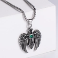 Detailed view of a vintage angel wing cross pendant with a green zircon on a box chain - Steel Color (No Chain)