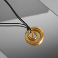 Close-up of a 18k gold plated spiral pendant with black cord on a reflective surface - Adjustable within 60cm / Gold