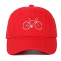 Close-up of white bicycle embroidery on a red cotton baseball cap with curved visor - Red