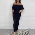 Dettaglio dell'abito nero in maglia a spalle scoperte con intricati motivi a traforo - XS / Nero