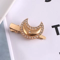 Detailed view of a gold hair clip with sparkling rhinestones in moon and star patterns - 8# Rhinestone Moon Metal Duckbill Clip