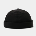 Macro detail of breathable black docker cap showing woven fabric texture and stitching - Adjustable / Black
