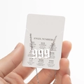 Gothic 999 angel number necklace in silver finish with a white display card - 999 / Steel