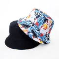Detail showing reversible tie-dye bucket hat with banana graffiti and black cotton fabric - Banana Letter Graffiti