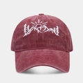 Macro detail of mountain range embroidery on a washed burgundy cotton baseball cap - Adjustable / Burgundy