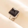 Macro view of vintage 304 stainless steel ring with square black marble stone and open band - Silver/Black Marble