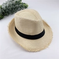 Detail shot of breathable straw fedora hat with black ribbon and frayed edges - M / Beige