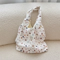 Close-up of white bubble fabric shoulder bag featuring cute dog prints and stars - Star Dog