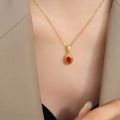 Golden necklace featuring a mystical Egyptian pharaoh style oval red gemstone pendant - Necklace / Gold Red Zirconia / 40+5cm