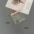 Detailed view of a 9x9cm clear EVA jewelry storage pouch with pink zipper for bracelets - 50 Silk Pink Transparent Circle Slider Bag / 9x9cm