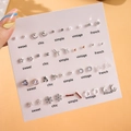 Macro detail of multi-style earring set with pearls and zircons on card display - 20 Pairs Minimalist Mixed Set (E0049-1)