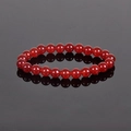 Polished 8mm red natural stone beaded bracelet with glossy finish on dark reflective surface - Faux Red Agate
