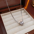 Macro view of silver geometric layered necklace featuring a sparkling zircon-set pendant - Silver (Real Gold Plated)